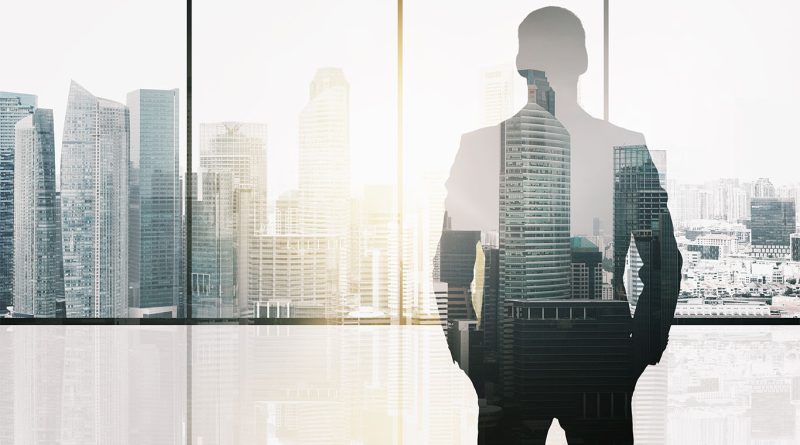Image of a males silhouette in a skyscraper office building to support CEO daily routine article