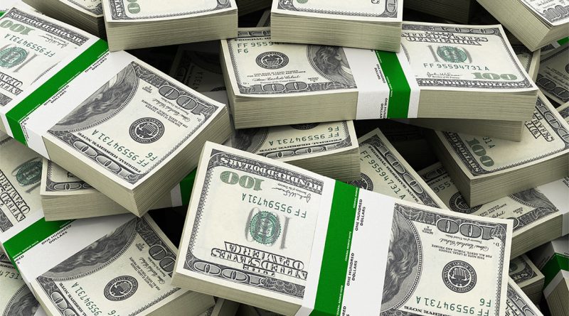 Image of numerous stacks of American dollars piled on top of each other to support 6 figure side hustle article
