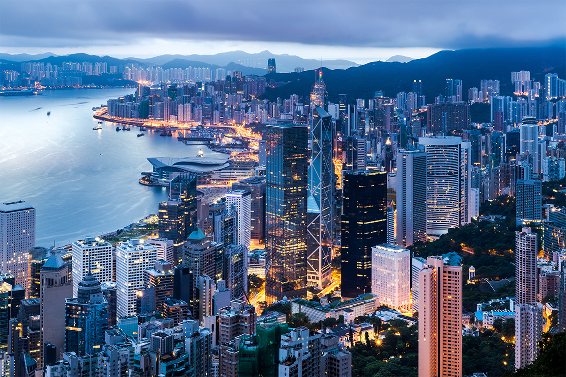 Panoramic view of the Hong Kong skyline at night to support one country two systems article