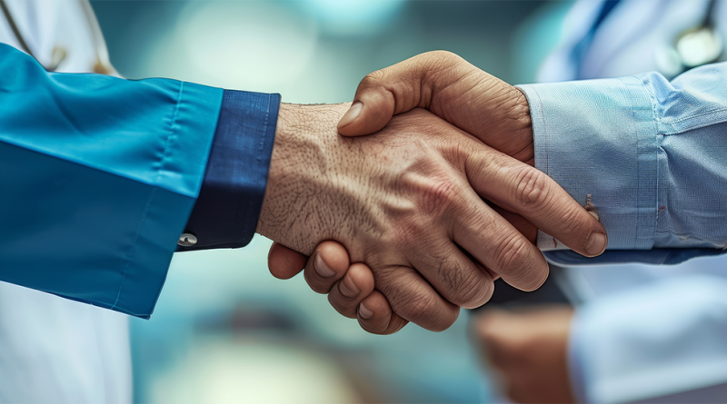 Two business professionals having a handshake to support new Aston Martin CEO article