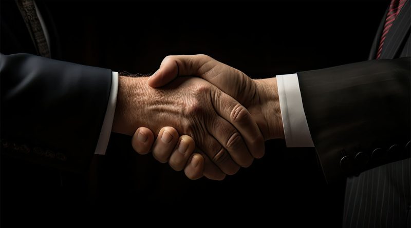Two business professionals shaking hands to support Elon Musk political plans article