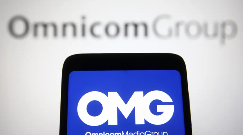 Omnicom logo on phone screen to support Omnicom and Interpublic merger article