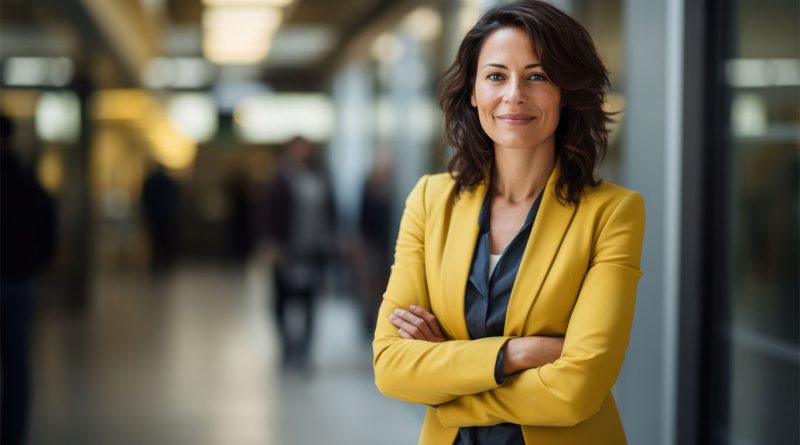 Female CEO stood in office environment