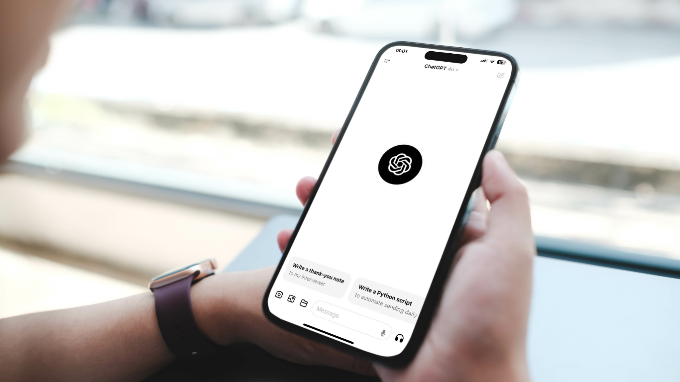Person using a smartphone with the ChatGPT app open, exploring AI-powered startup companies.