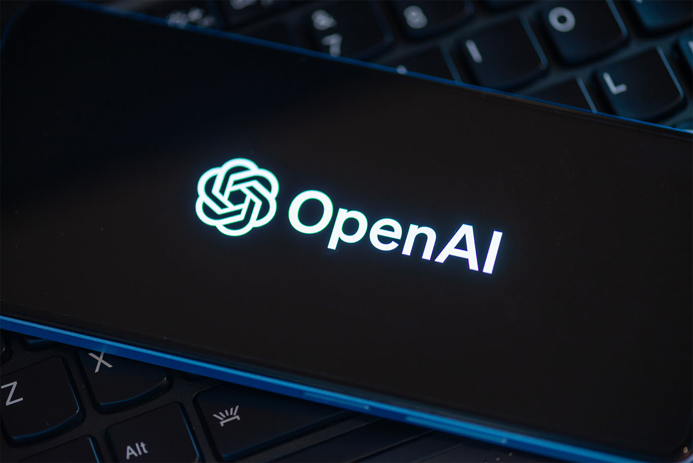 OpenAI logo on phone screen