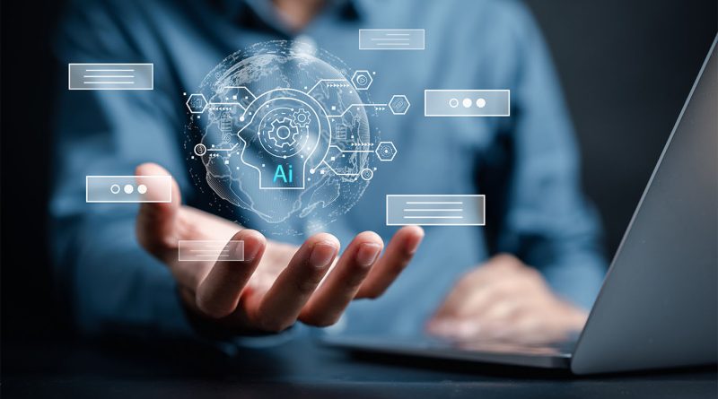 A business professional holds a glowing digital interface with an AI icon, symbolizing artificial intelligence innovation and global data connectivity, while working on a laptop.