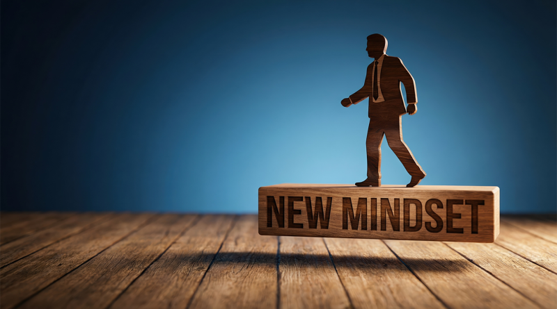 Wooden figure of a businessman stepping forward on a block labeled new mindset symbolizing leadership growth and transformation