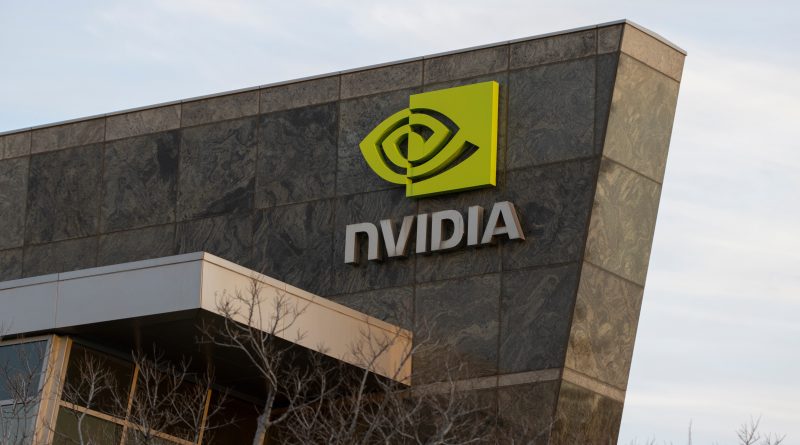 Nvidia CEO Jensen Huang presenting AI infrastructure technology during a global technology conference.