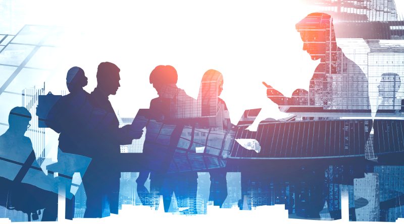 Employees collaborating in a modern office environment, representing career development, workforce training and talent retention strategies at leading employers.